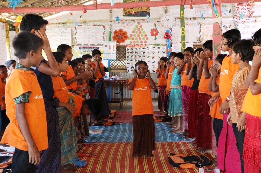Amina leads her friends in an action song at a Canada-supported World Vision child-friendly space in Cox’s Bazar.Photo: Himaloy Joseph Mree/World Vision
