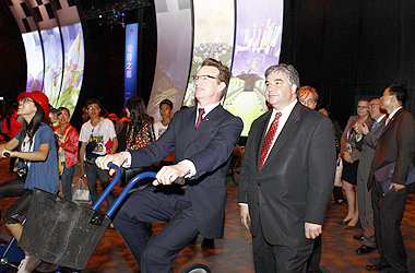 The Honourable Peter Van Loan, Minister of International Trade, tours the exhibits in the Canada Pavilion at the Shanghai Expo, with the pavilion's Commissioner General Mark Rowswell.