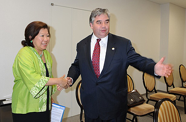 The Honourable Peter Van Loan, Minister of International Trade, greets Indonesia Minister of Trade, Mari Pangestu, at the APEC meeting for ministers responsible for trade, Sapporo, Japan.  