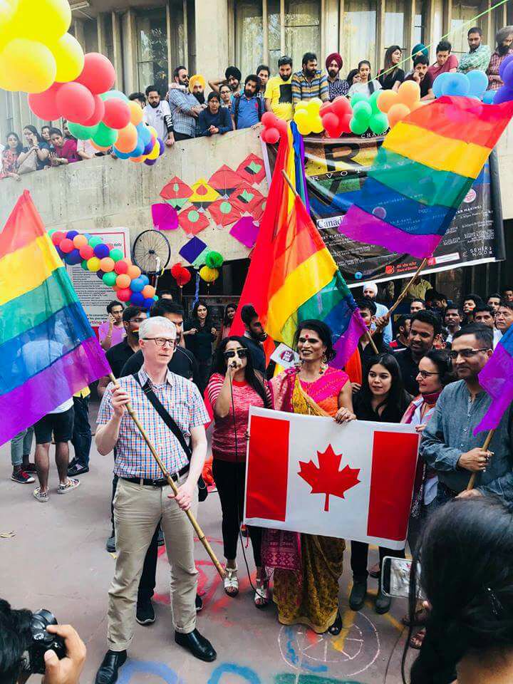 Consul General Christopher Gibbins holds the Pride flag during Chandigarh’s 2018 Pride Week.