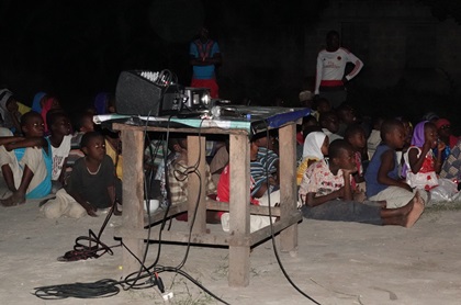 Children in Zanzibar wait for a screening of the film to begin. [Photo: Samson Kapinga]