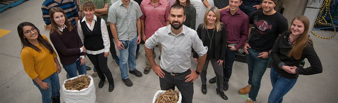 A group of students and their professor in a research center.