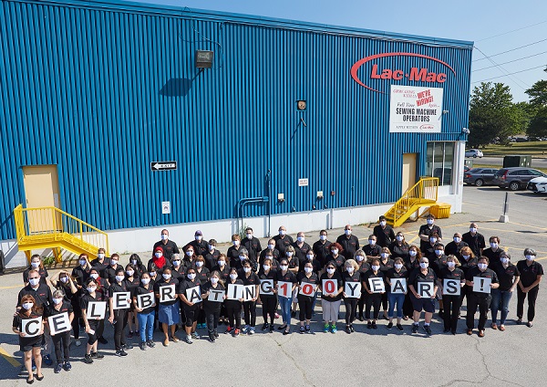 Photo of Lac-Mac employees celebrating 100 years of business