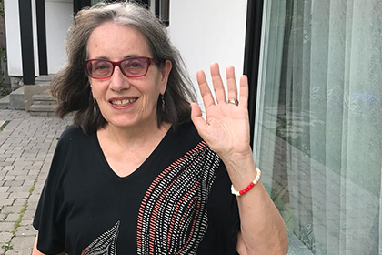 Peggy Thorpe displaying the menstruation bracelet she wears on her wrist.