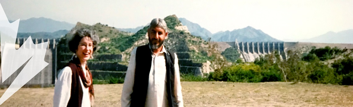 Isabelle Bérard, smiling, and a man, in Pakistan.