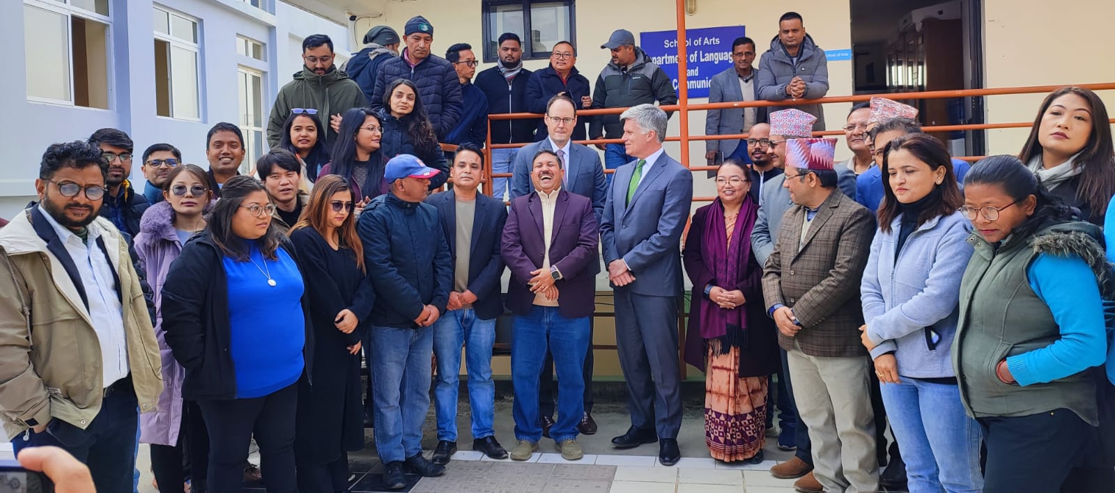 A group of about 35 people posing for the camera. Canada’s Ambassador to Nepal, His Excellency Cameron MacKay is in the centre with journalists who participated in the workshop standing on his either side.